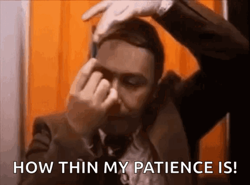 A Man In A Suit And Tie Is Covering His Face With His Hands And Says `` How Thin My Patience Is ! '' GIF