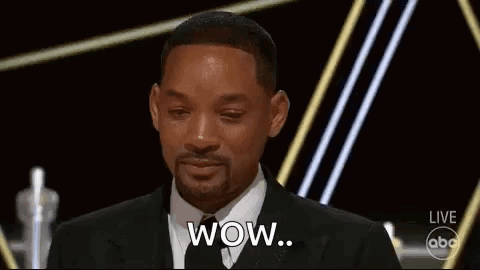 A Man In A Suit And Tie Is Crying While Giving A Speech . GIF
