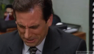 A Man In A Suit And Tie Is Crying With Tears Running Down His Face . GIF