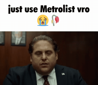 A Man In A Suit And Tie Is Crying With The Words Just Use Metrolist Vro GIF