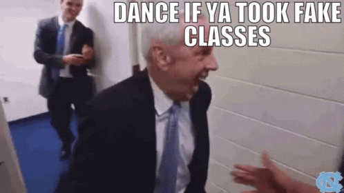 A Man In A Suit And Tie Is Dancing In A Hallway With The Words Dance If Ya Took Fake Classes Above Him . GIF