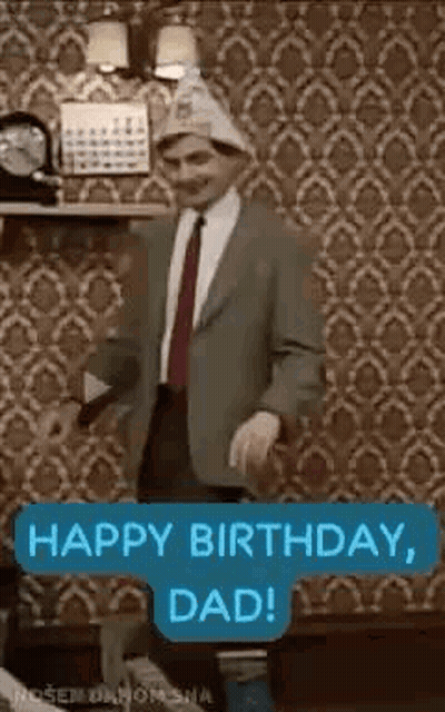 A Man In A Suit And Tie Is Dancing In A Living Room . GIF