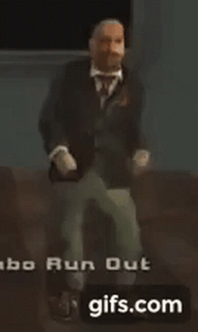 A Man In A Suit And Tie Is Dancing In A Video Game GIF