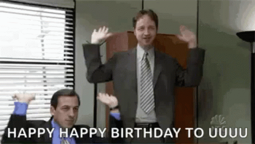 A Man In A Suit And Tie Is Dancing In An Office While Another Man Says `` Happy Happy Birthday To Uuuu '' . GIF
