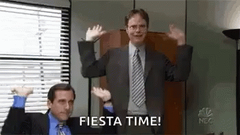 A Man In A Suit And Tie Is Dancing In An Office While Another Man Watches . GIF