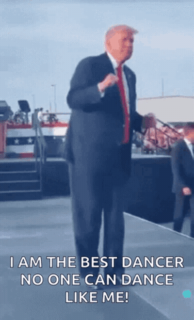 A Man In A Suit And Tie Is Dancing On A Stage And Says I Am The Best Dancer No One Can Dance Like Me ! GIF