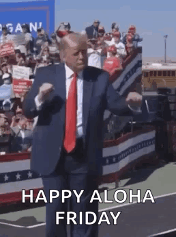 A Man In A Suit And Tie Is Dancing On A Stage . GIF