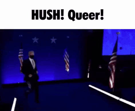 A Man In A Suit And Tie Is Dancing On A Stage In Front Of A Blue Background . GIF