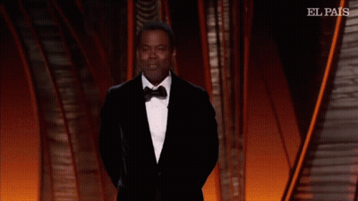 A Man In A Suit And Tie Is Dancing On A Stage With El Pais Written On The Bottom GIF
