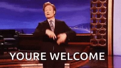 A Man In A Suit And Tie Is Dancing On A Stage With The Words `` Youre Welcome '' . GIF
