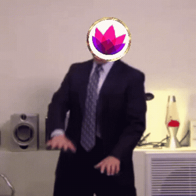 A Man In A Suit And Tie Is Dancing With A Purple Flower On His Head GIF