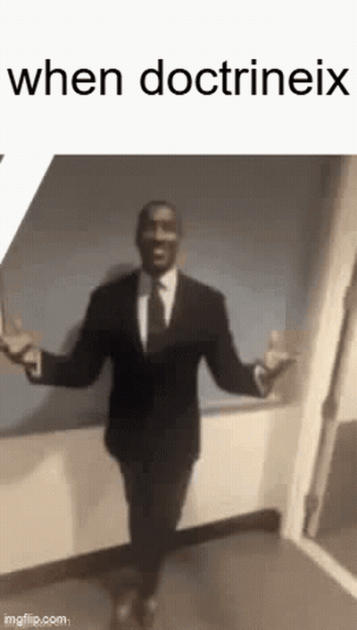 A Man In A Suit And Tie Is Dancing With His Arms Outstretched In A Hallway . GIF