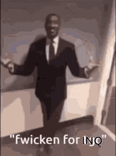 A Man In A Suit And Tie Is Dancing With The Words Fwicken For Inq Above Him GIF