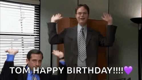 A Man In A Suit And Tie Is Dancing With The Words Tom Happy Birthday Written Below Him GIF