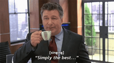 A Man In A Suit And Tie Is Drinking A Cup Of Coffee And Says " Singing Simply The Best ... " GIF