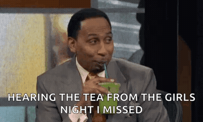 A Man In A Suit And Tie Is Drinking A Green Drink From A Plastic Cup . GIF