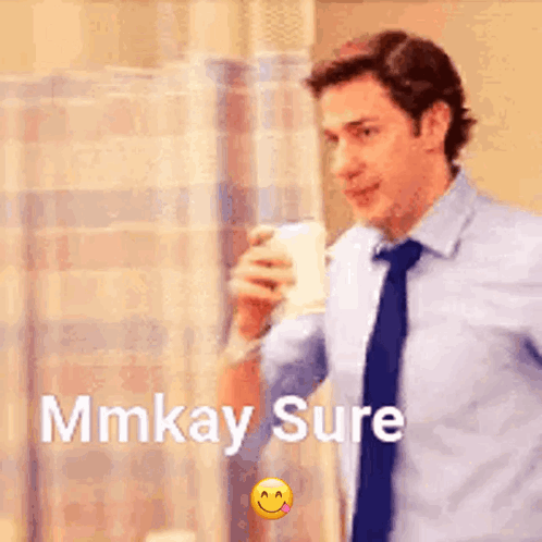 A Man In A Suit And Tie Is Drinking From A Cup And Says Mmkay Sure . GIF