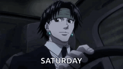 A Man In A Suit And Tie Is Driving A Car And The Word Saturday Is On The Screen Behind Him . GIF