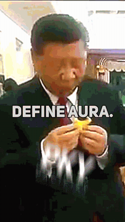 A Man In A Suit And Tie Is Eating A Hamburger With The Words Define Aura Written Below Him GIF