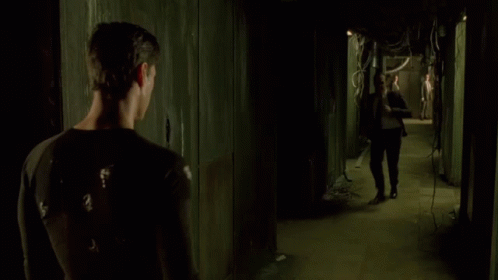 A Man In A Suit And Tie Is Fighting Another Man GIF