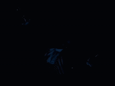 A Man In A Suit And Tie Is Floating In The Water GIF