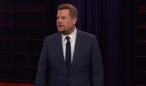 A Man In A Suit And Tie Is Giving A Speech GIF