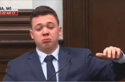 A Man In A Suit And Tie Is Giving A Speech GIF