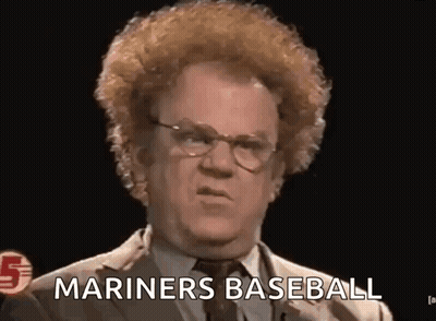 A Man In A Suit And Tie Is Giving A Speech And Saying `` Mariners Baseball '' . GIF