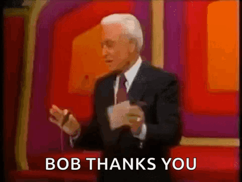 A Man In A Suit And Tie Is Giving A Speech And The Words Bob Thanks You Are Below Him GIF