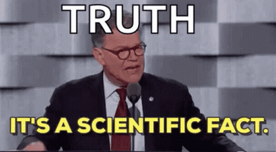 A Man In A Suit And Tie Is Giving A Speech At A Podium With A Microphone . GIF