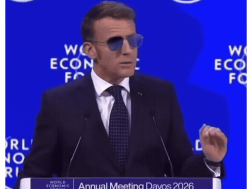 A Man In A Suit And Tie Is Giving A Speech At The World Economic Forum Annual Meeting GIF