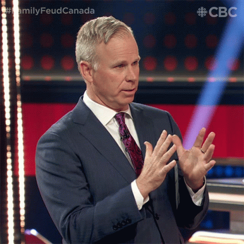 A Man In A Suit And Tie Is Giving A Speech In Front Of A Cbc Logo GIF