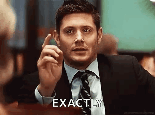 A Man In A Suit And Tie Is Giving A Thumbs Up And Saying `` Exactly '' . GIF
