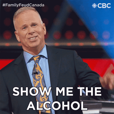 A Man In A Suit And Tie Is Giving A Thumbs Up And Says Show Me The Alcohol GIF