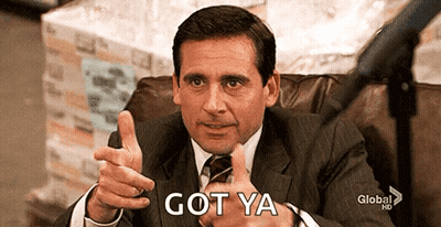 A Man In A Suit And Tie Is Giving A Thumbs Up And The Words Got Ya Are Behind Him GIF