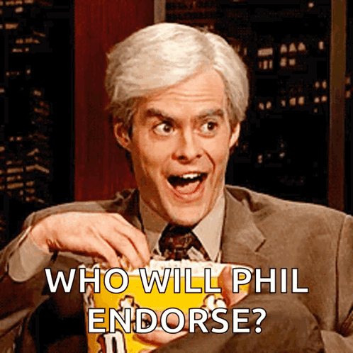 A Man In A Suit And Tie Is Holding A Bag Of Popcorn With The Words Who Will Phil Endorse Below Him GIF