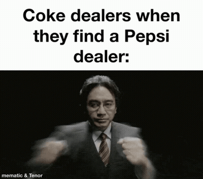 A Man In A Suit And Tie Is Holding A Bottle Of Pepsi GIF