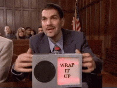 A Man In A Suit And Tie Is Holding A Box That Says " Wrap It Up " GIF