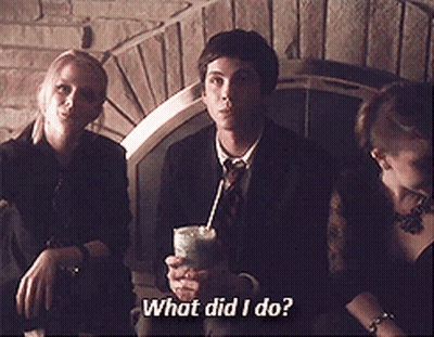 A Man In A Suit And Tie Is Holding A Drink In His Hand And Asking What Did I Do GIF