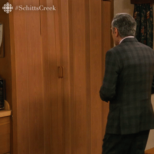 A Man In A Suit And Tie Is Holding A Glass Of Champagne And Says " Nothing To See Here People " In The Corner GIF