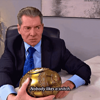 A Man In A Suit And Tie Is Holding A Gold Ball And Says " Nobody Likes A Snitch " GIF