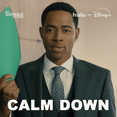 A Man In A Suit And Tie Is Holding A Green Folder And The Words Calm Down Are Above Him GIF