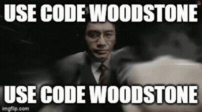 A Man In A Suit And Tie Is Holding A Gun With A Caption That Says Use Code Woodstone GIF