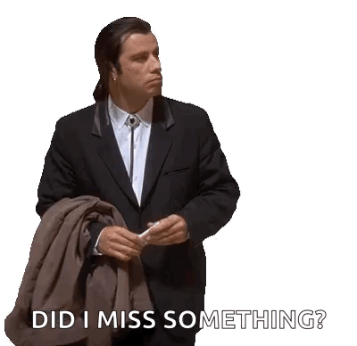 A Man In A Suit And Tie Is Holding A Jacket And A Cell Phone And Says Did I Miss Something . GIF