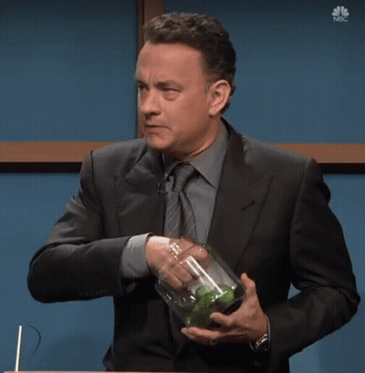 A Man In A Suit And Tie Is Holding A Jar Of Pickles With The Words I Wanted A Pickle Below Him GIF