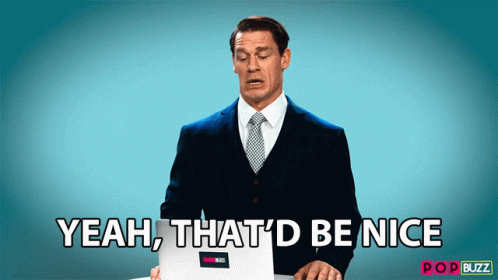 A Man In A Suit And Tie Is Holding A Laptop And Says " Yeah That 'D Be Nice " GIF