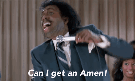 A Man In A Suit And Tie Is Holding A Microphone And Saying Can I Get An Amen ! GIF