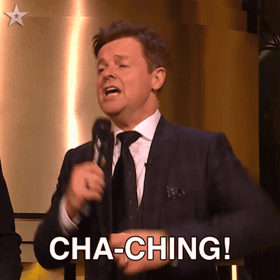 A Man In A Suit And Tie Is Holding A Microphone And Says Cha-Ching GIF