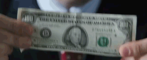 A Man In A Suit And Tie Is Holding A One Dollar Bill . GIF