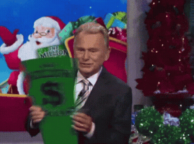 A Man In A Suit And Tie Is Holding A One Million Dollar Socks GIF